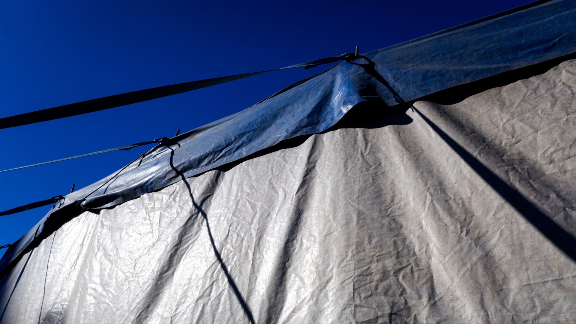 tarp covering skip bin