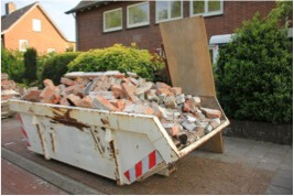 a skip bin full of bricks waste