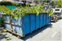 green waste in a large skip bin