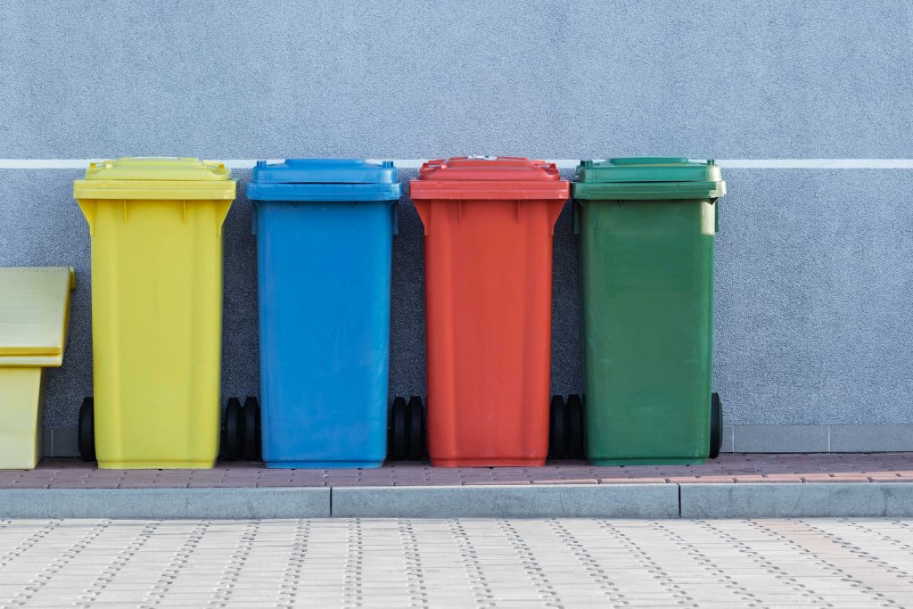 four bins of different colours