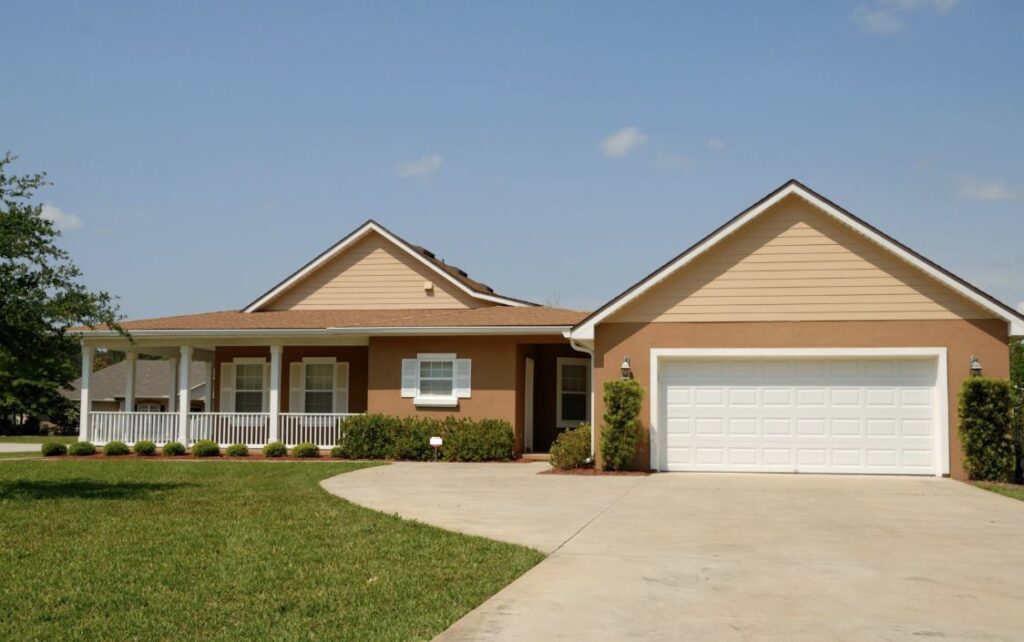 home with a driveway and lawn in front