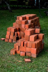 pile of bricks on a lawn