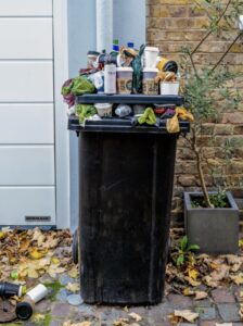 over-flowing rubbish bin