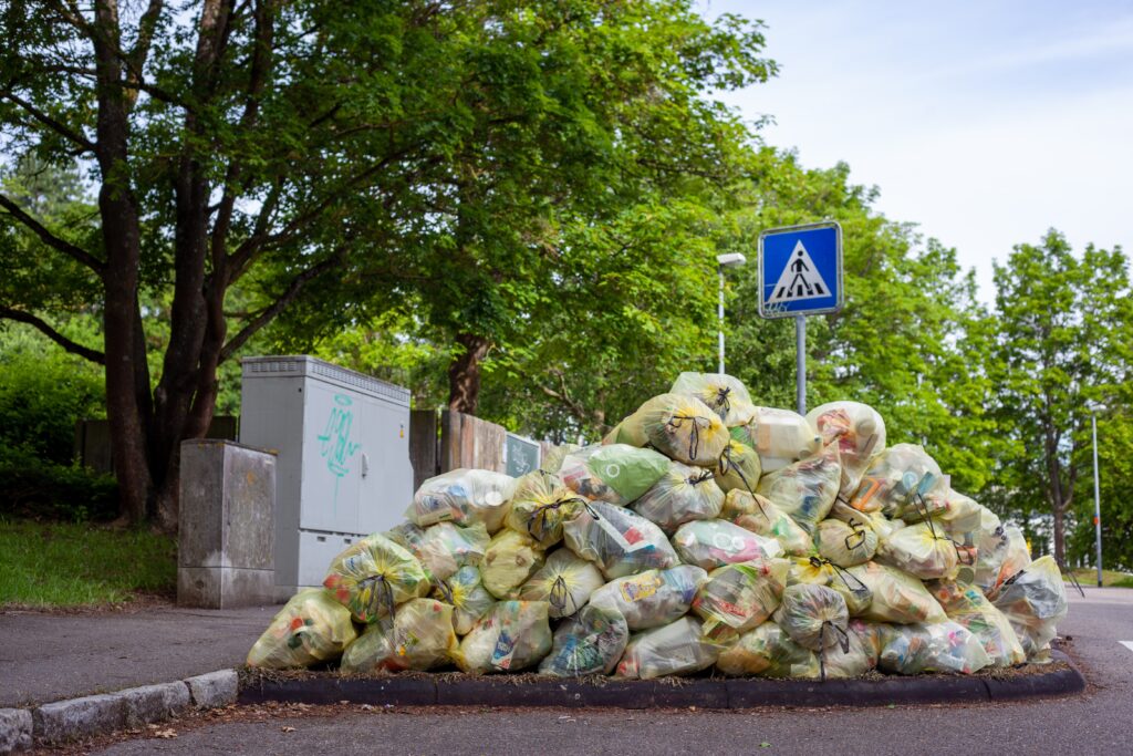 A pile of rubbish bags on the street