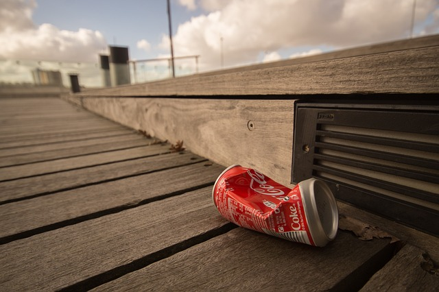 soda can on a boardwalk
